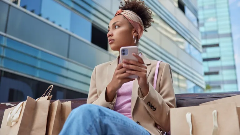 Woman with bags, after Consumer Spending Trends.